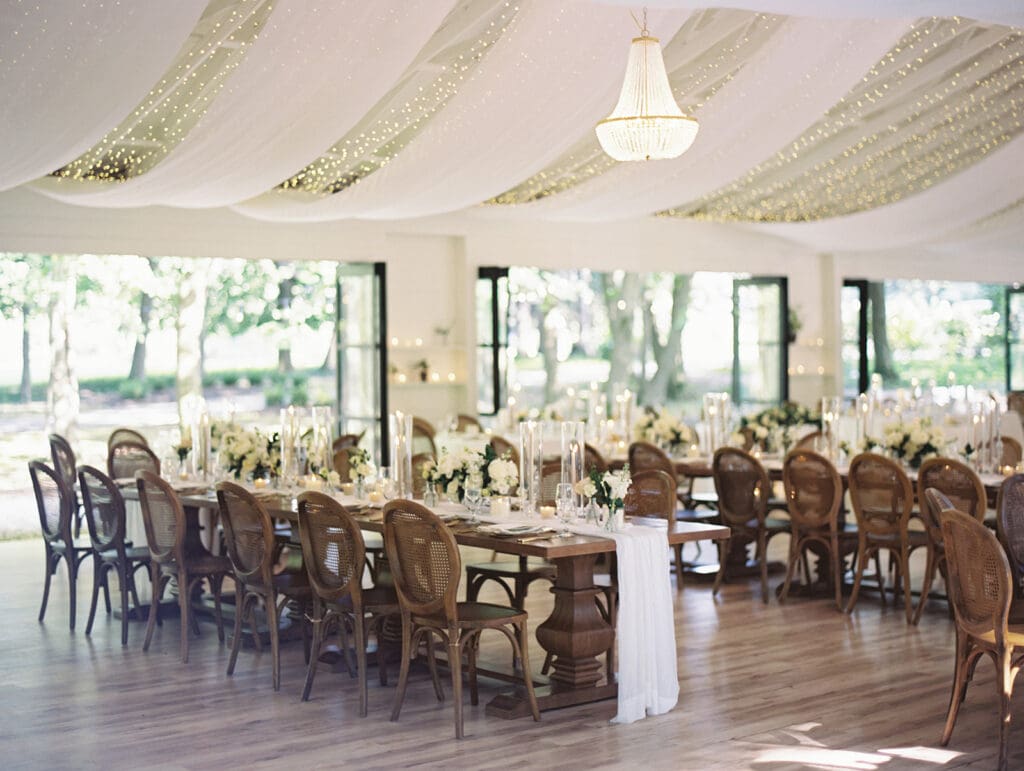 An elegant indoor Greencrest Manor wedding reception in the celebration house. 