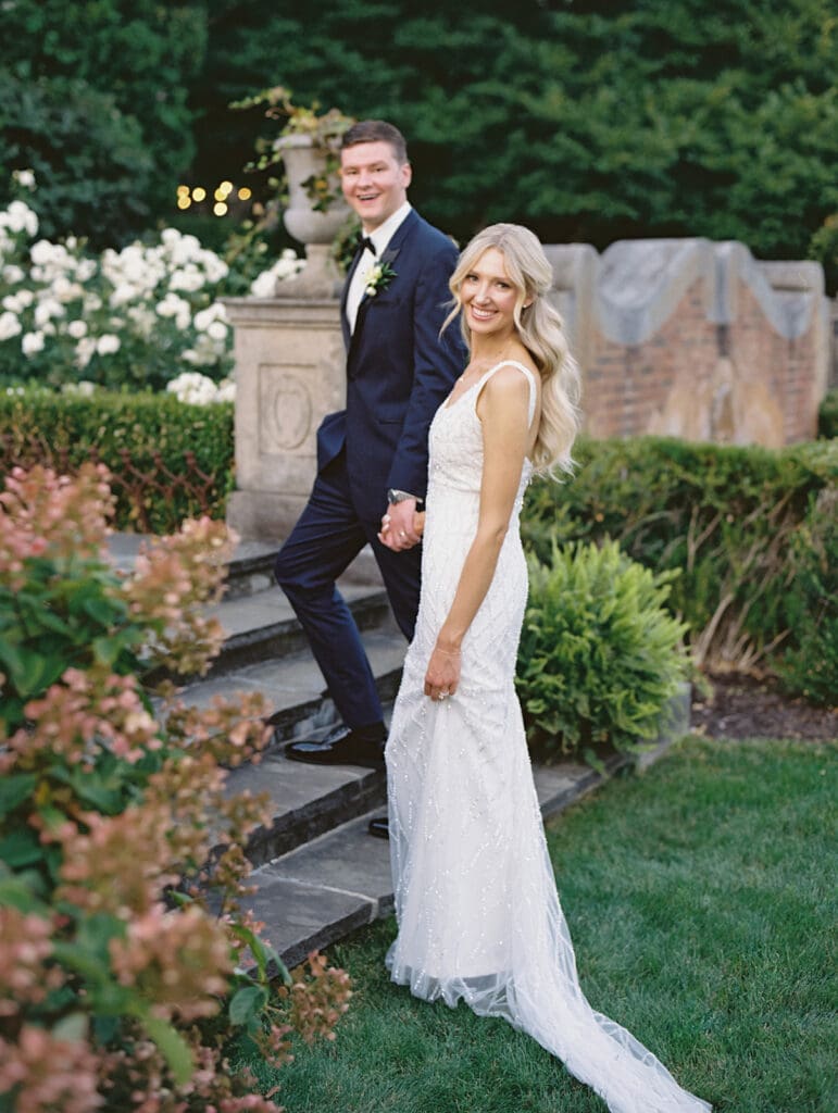 Bride and grooms portraits in the gardens at Greencrest Manor wedding venue in Battle Creek, Michigan