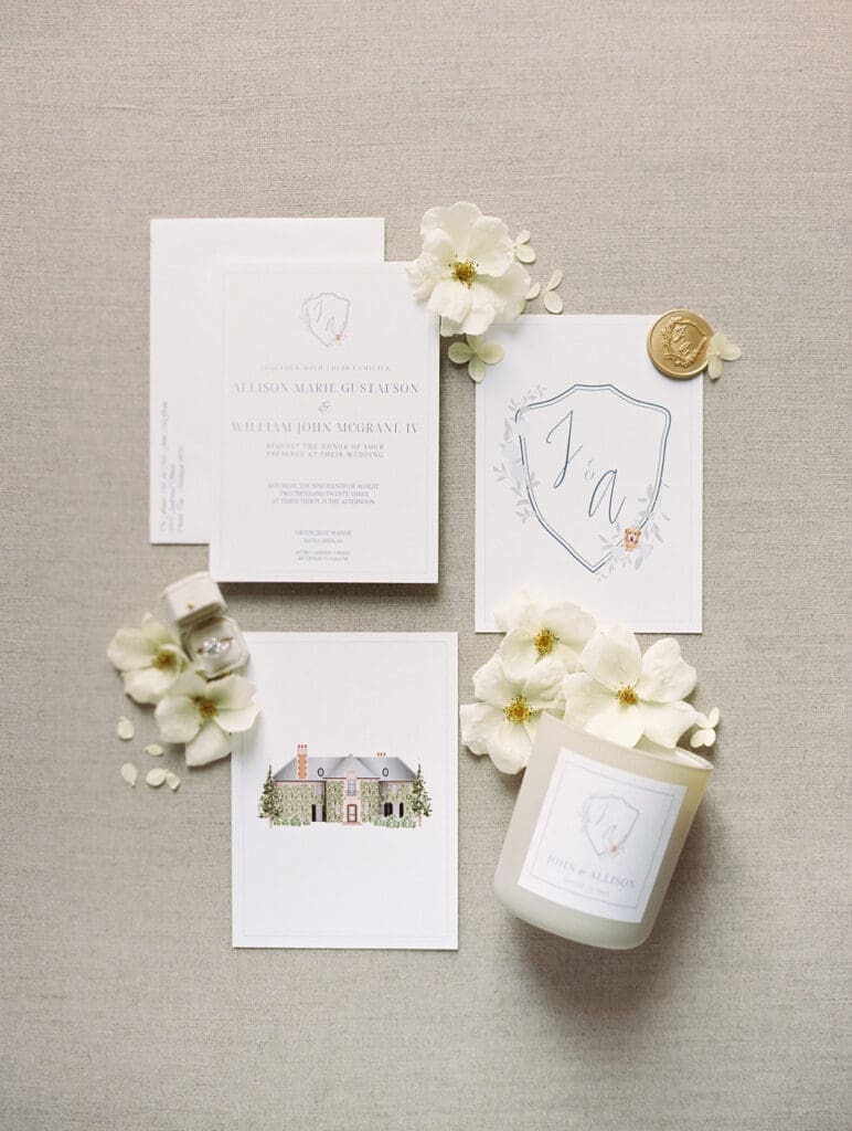 Greencrest Manor wedding invitations and details with florals and candles. 