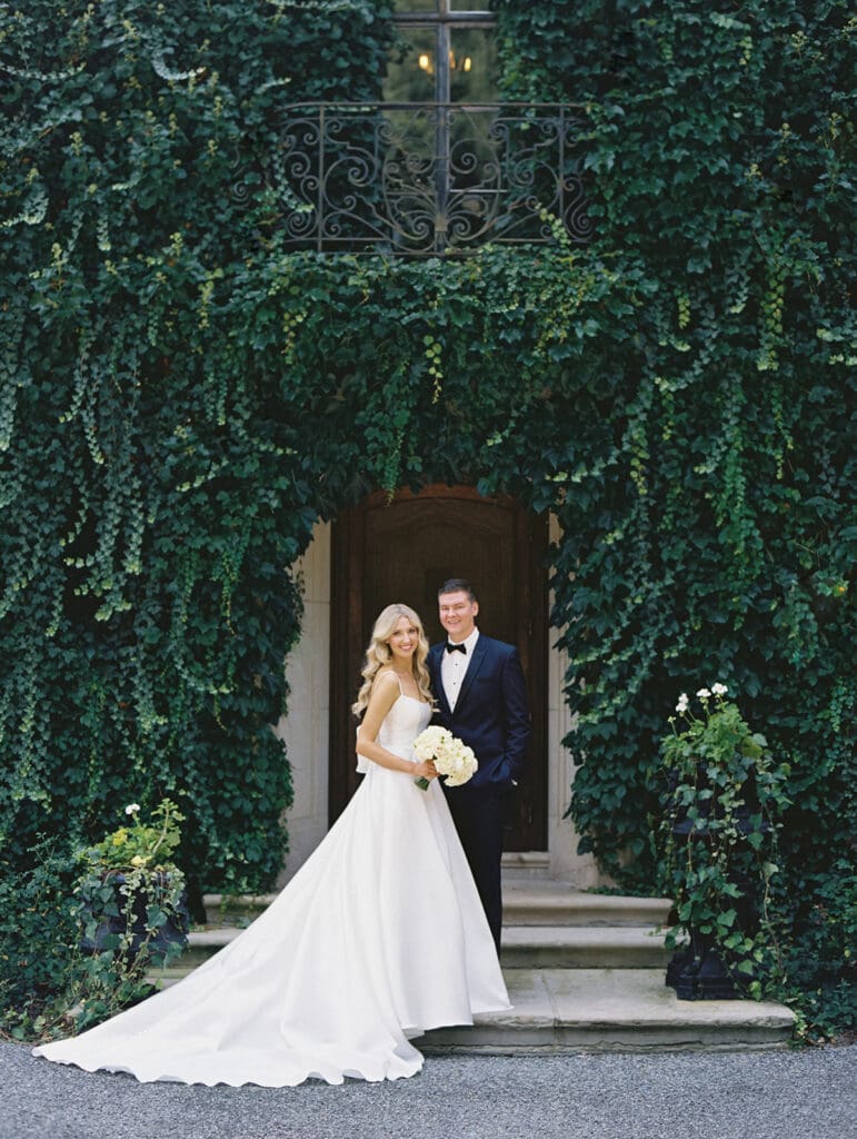 Bride and grooms portraits outside of Greencrest Manor wedding venue in Battle Creek, Michigan