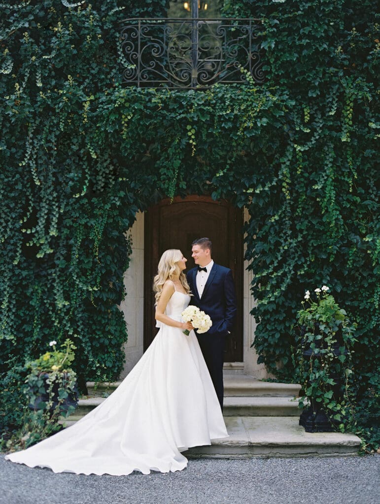 Bride and grooms portraits outside of Greencrest Manor wedding venue in Battle Creek, Michigan