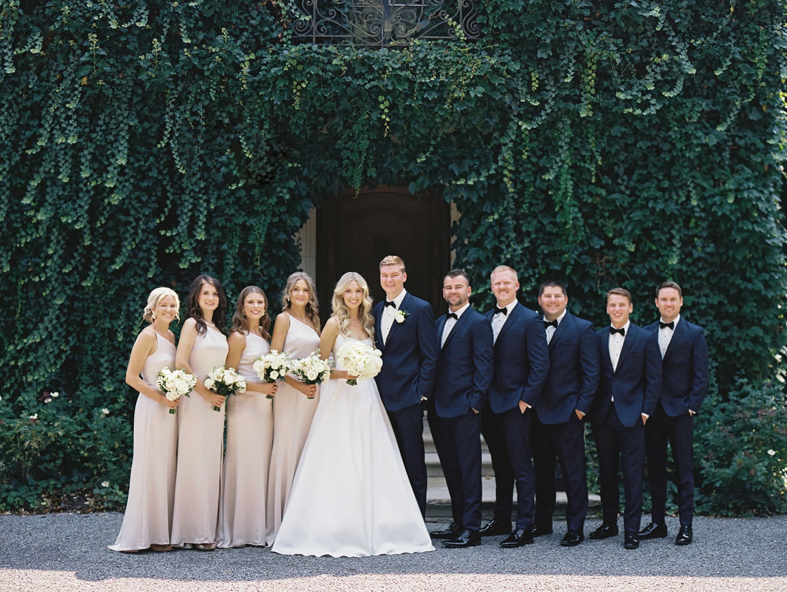 Wedding party photos outside of Greencrest Manor wedding venue in Battle Creek, Michigan