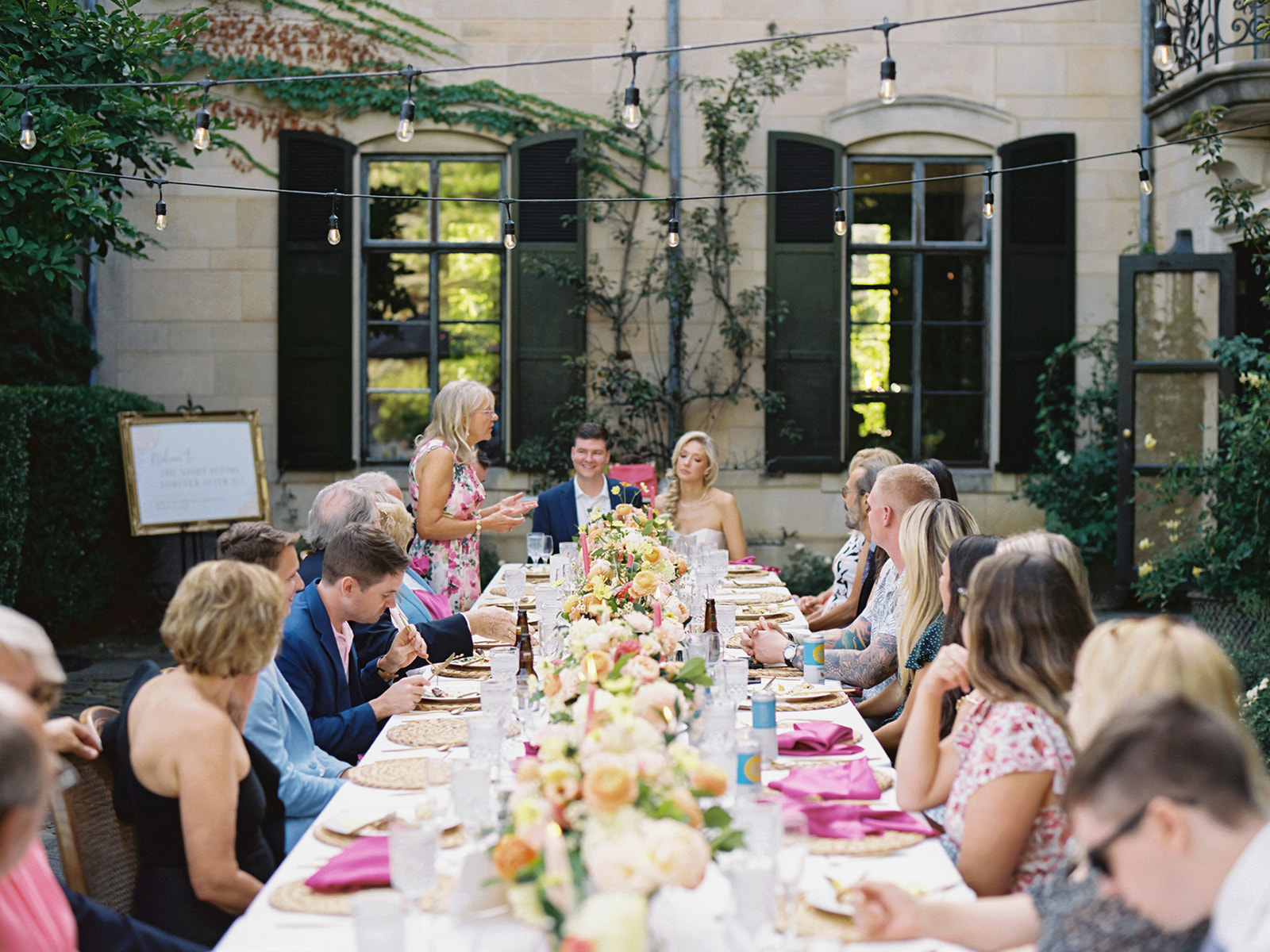 Bride and groom sitting at their table for their welcome party