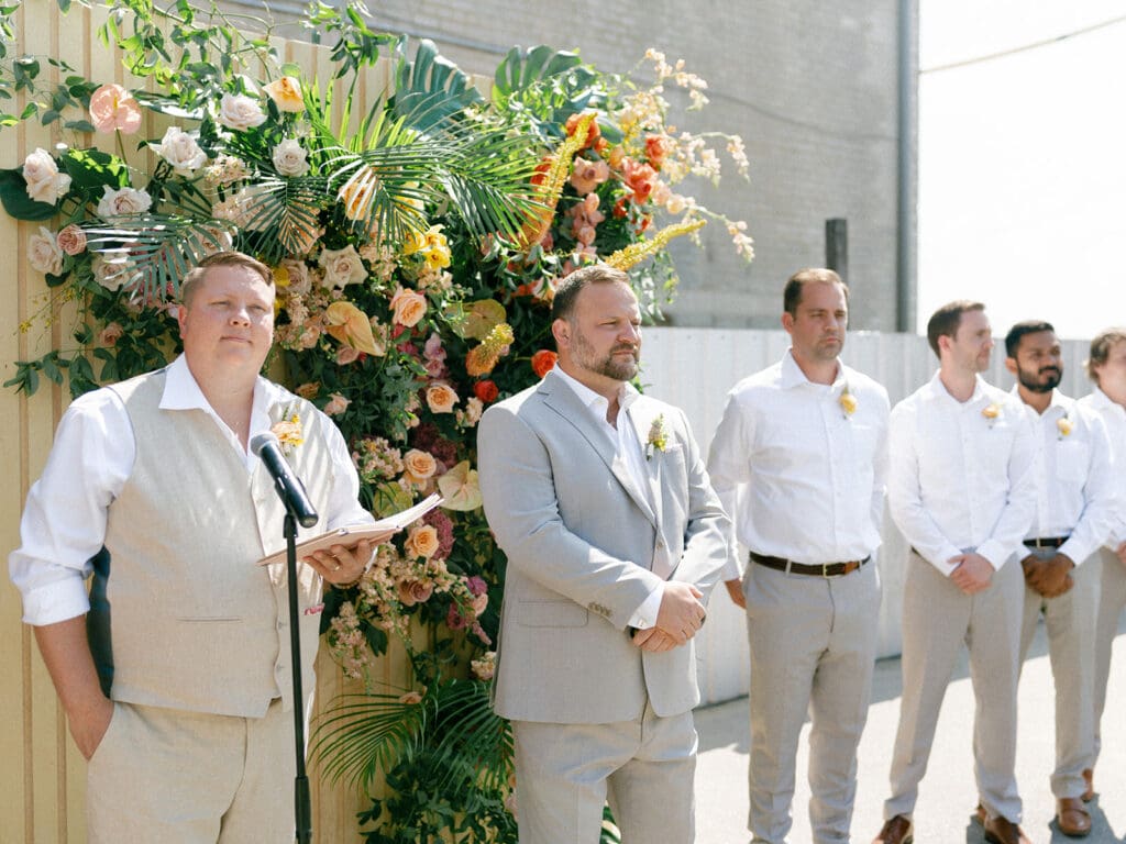 Groom waiting for his bride at the alter during their Journeyman Distillery wedding ceremony in Three Oaks, Michigan