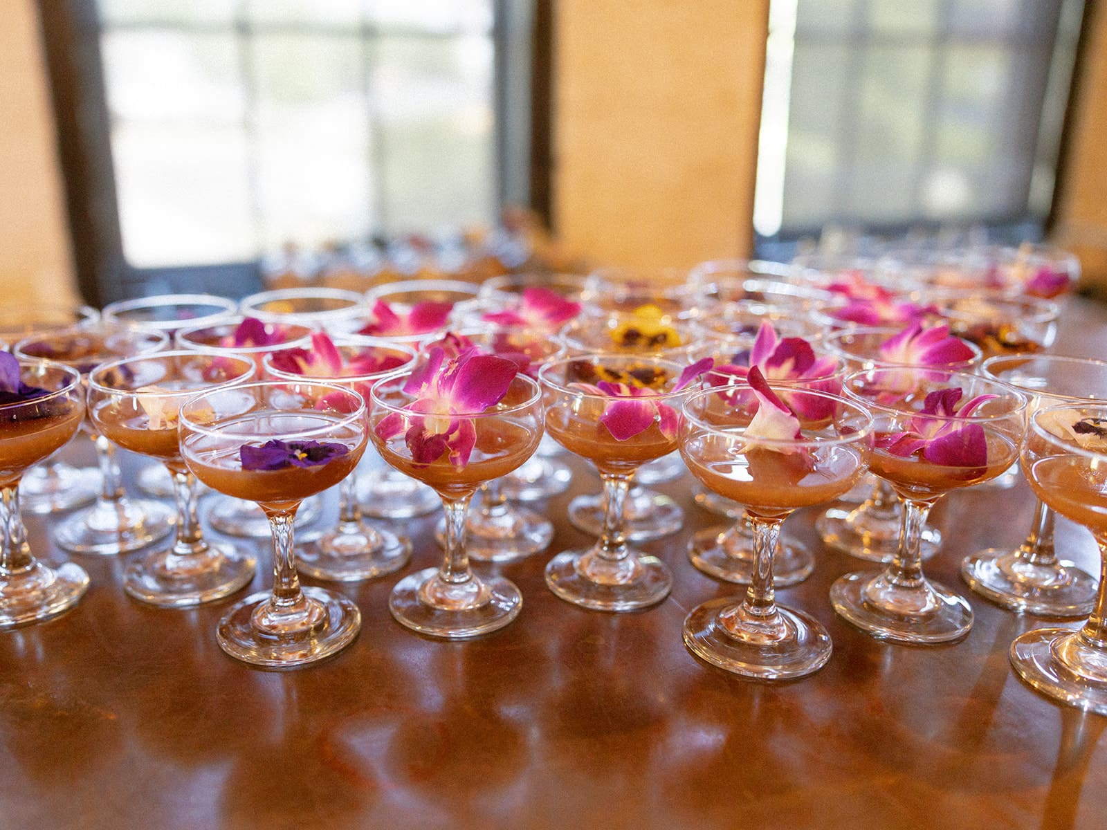 Custom cocktails with florals inside the glasses