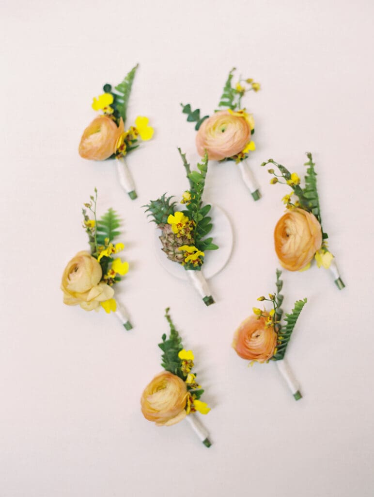 Groom and groomsmen's colorful and tropical inspired boutonnieres