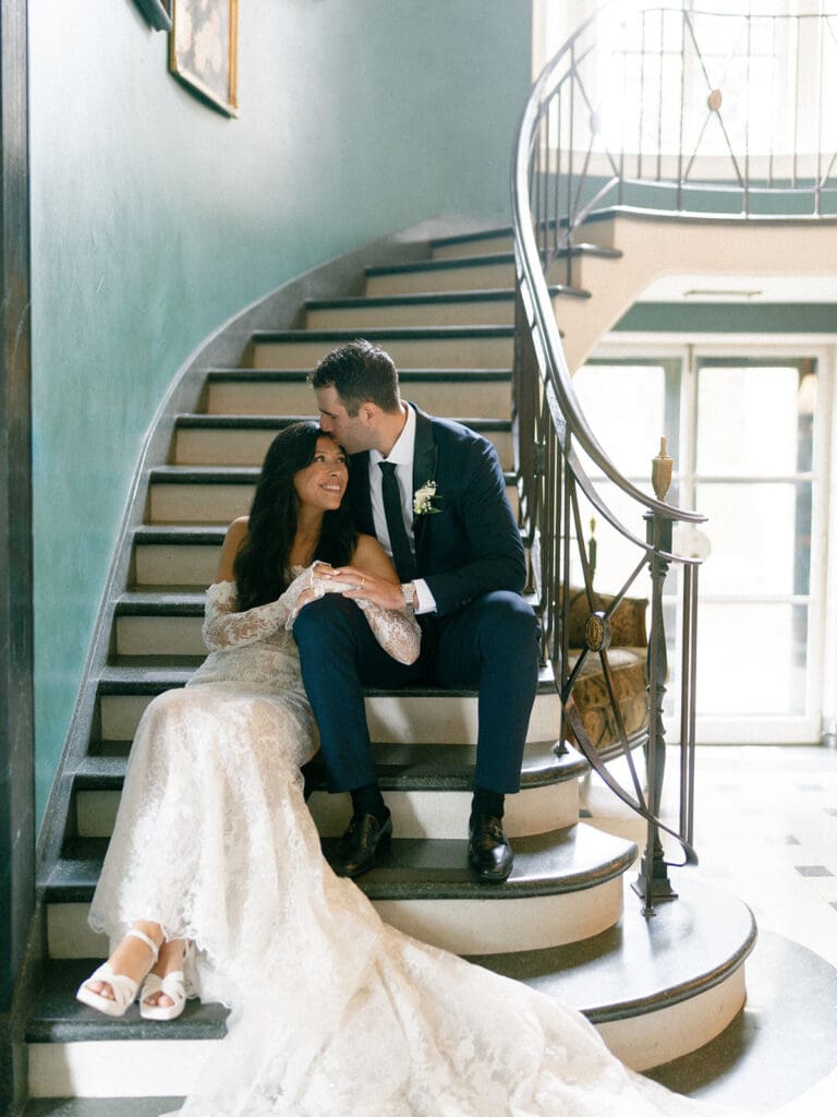 Bride and grooms indoor portraits on the staircase at Greencrest Manor - Estate wedding venue in Michigan
