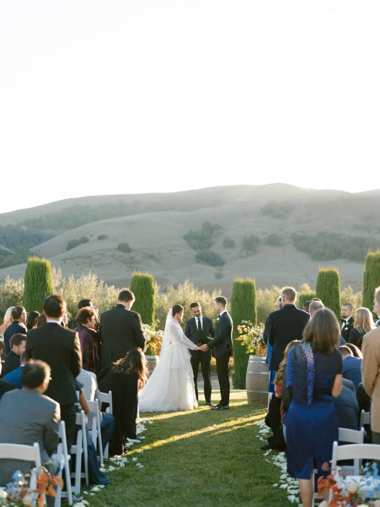 Bride and groom holding hands during their Viansa Winery ceremony in Sonoma, California