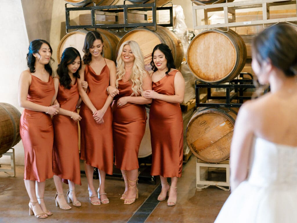 Bride sharing a first look with her bridesmaids