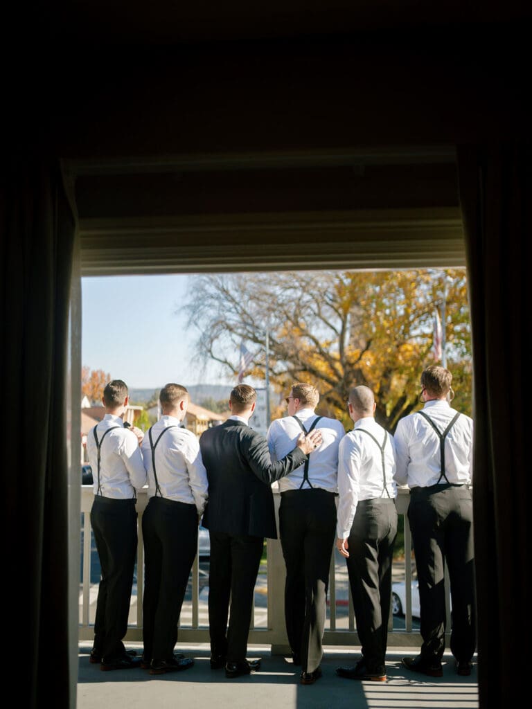 Groom and groomsmen standing on the porch at Viansa Winery