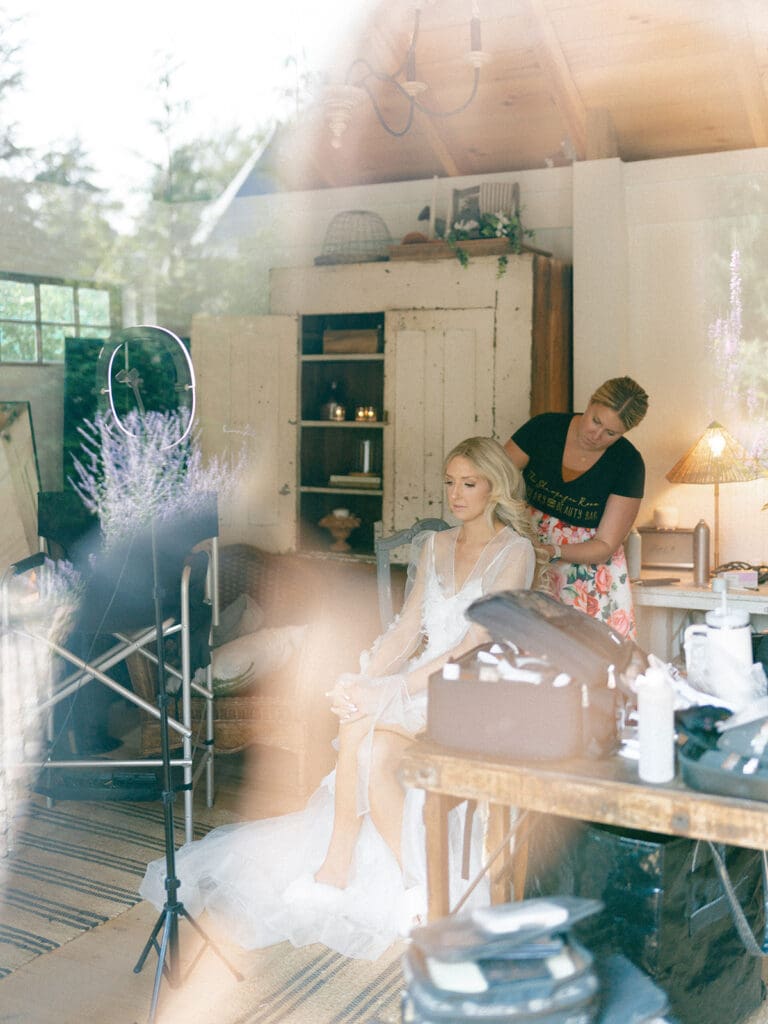 Bride getting her hair and makeup done in the She Shed at Greencrest Manor