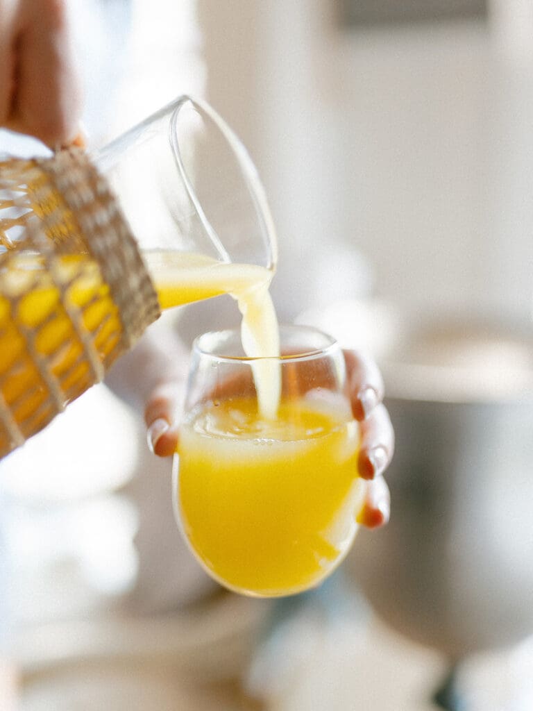 Mimosas being pourn the morning of a wedding