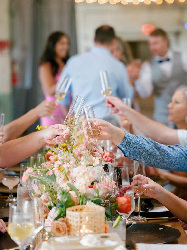 Wedding guests toasting during the reception