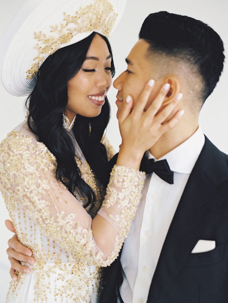 Bride and groom's studio portraits in South Bend, Indiana wearing traditional Vietnamese wedding attire. 
