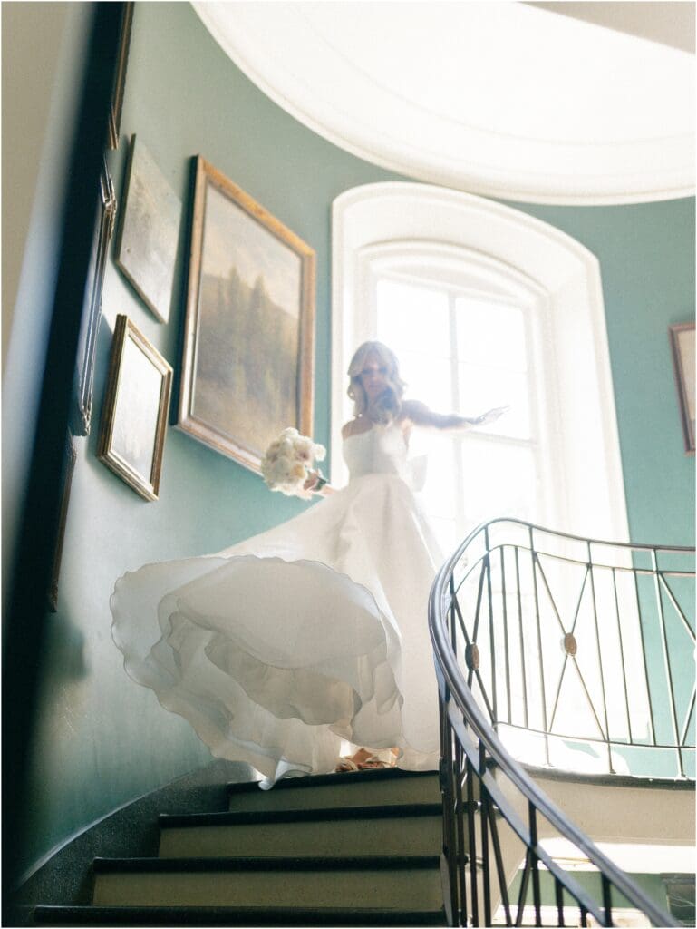 Bride walking down the stairs at Greencrest Manor - Estate wedding venue in Michigan
