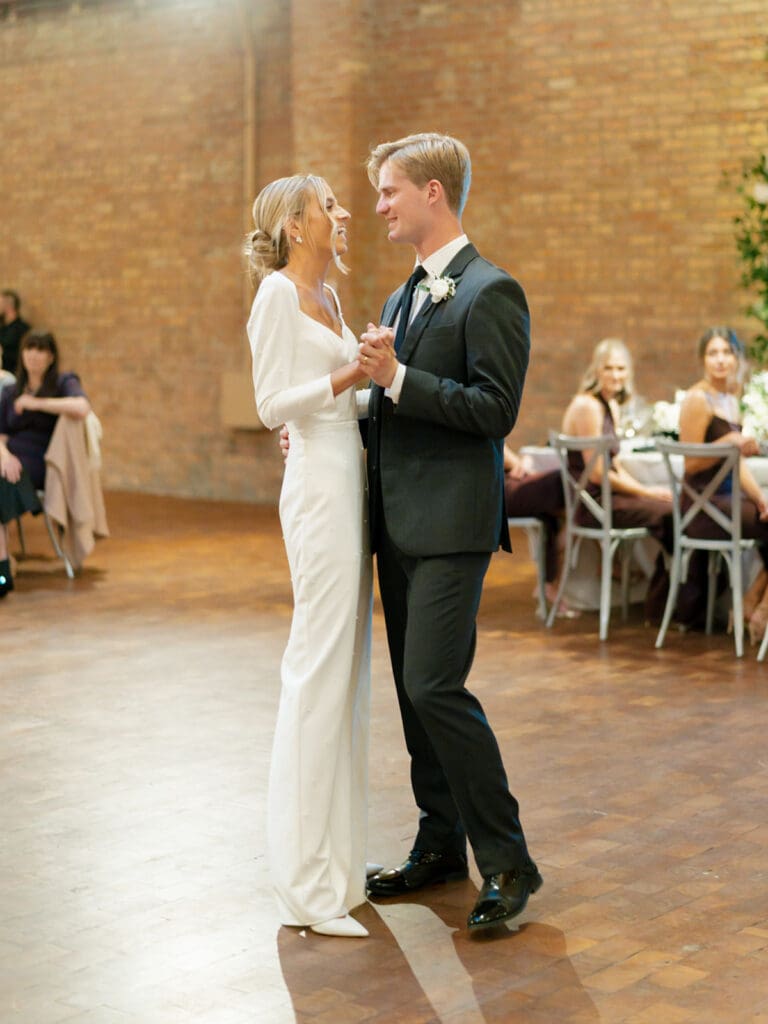 Bride and grooms first dance during their Rockwell on The River wedding reception in downtown Chicago
