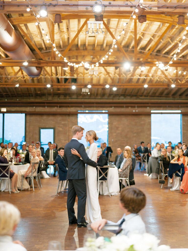 Bride and grooms first dance during their Rockwell on The River wedding reception in downtown Chicago