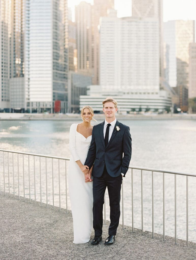 Bride and groom posing for their downtown Chicago wedding portraits