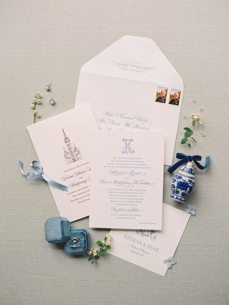 Classic University of Notre Dame wedding invitation and details flatlay shot