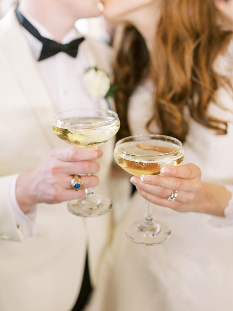 Bride and groom toasting with their champagne glasses