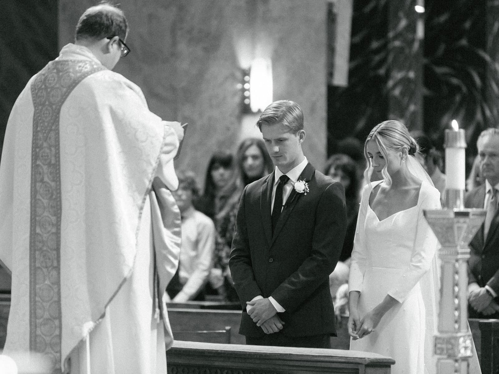 Bride and groom during their downtown Chicago wedding ceremony at Saint Clement Parish