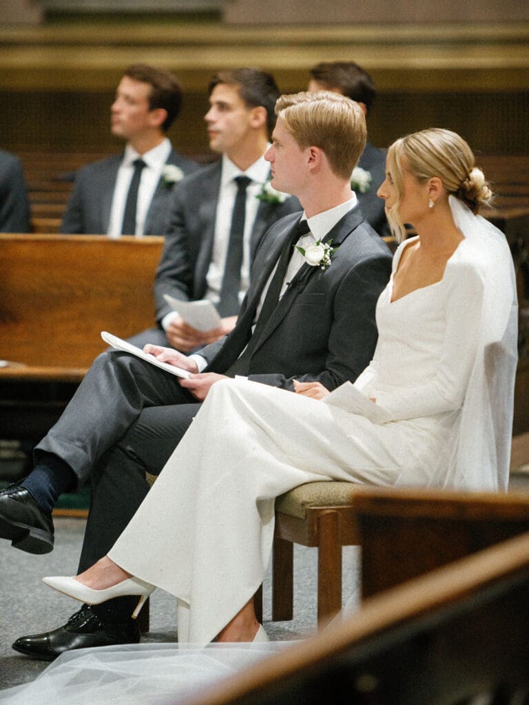 Bride and groom during their downtown Chicago wedding ceremony at Saint Clement Parish