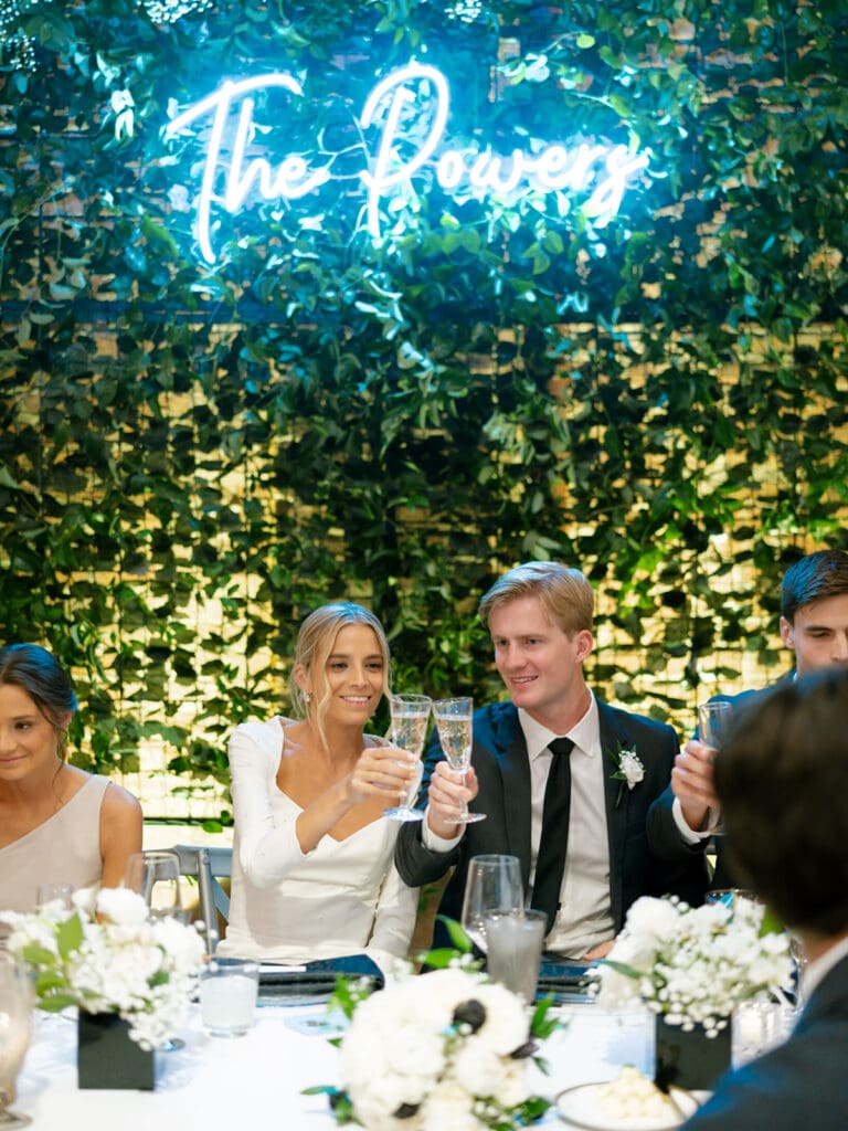 Bride and groom toasting during speeches