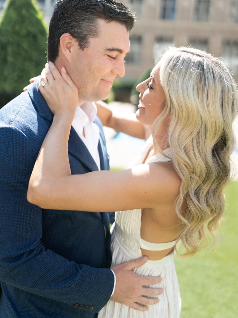 Man and woman posing for their New York engagement photoshoot