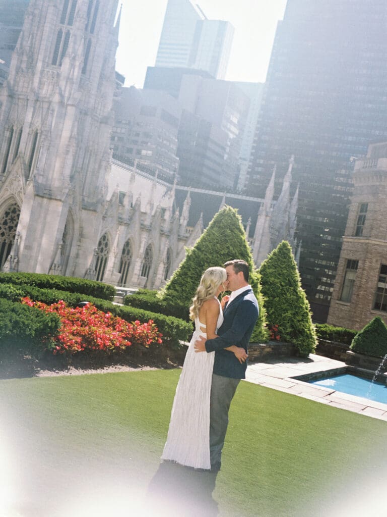 Couple kissing during their 620 Loft and Garden engagement photos in New York City