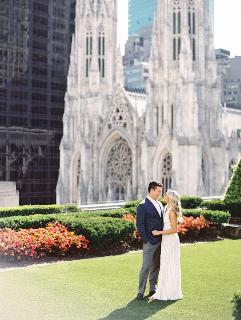 Couple posing for their 620 Loft and Garden engagement photos in New York City