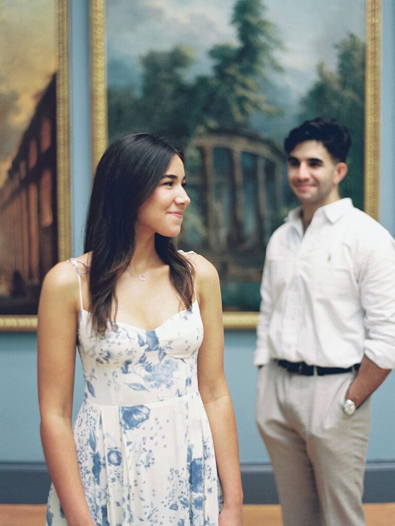 Editorial engagement photo of a couple posing at The Met