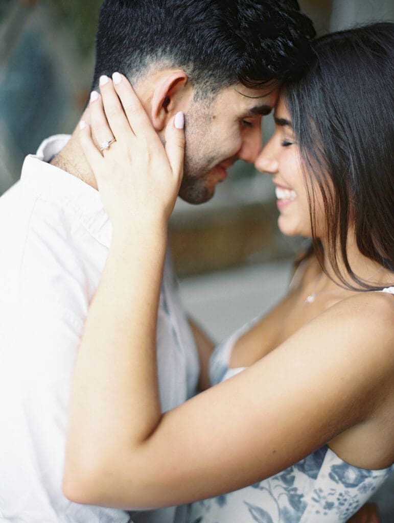 Couple posing for their romantic engagement session in New York City captured on film