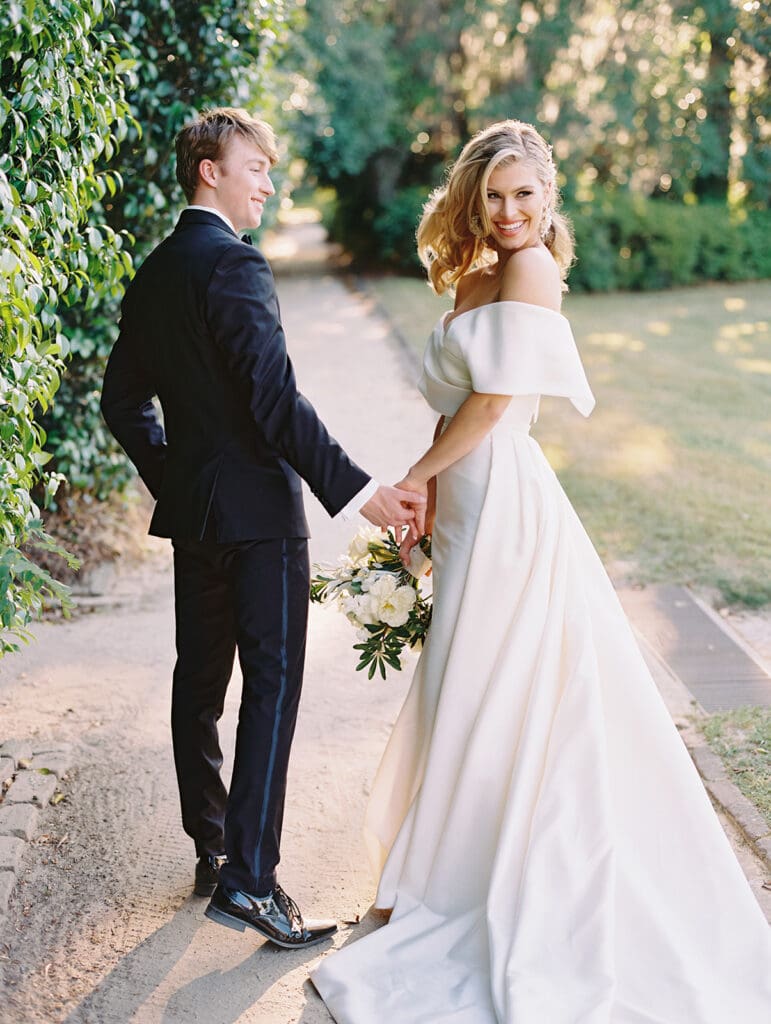 Bride and groom walking the grounds of Middleton Place wedding venue in Charleston, South Carolina