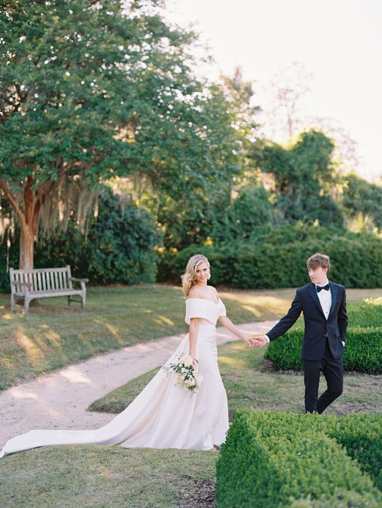 Bride and groom walking the grounds of Middleton Place wedding venue in Charleston, South Carolina