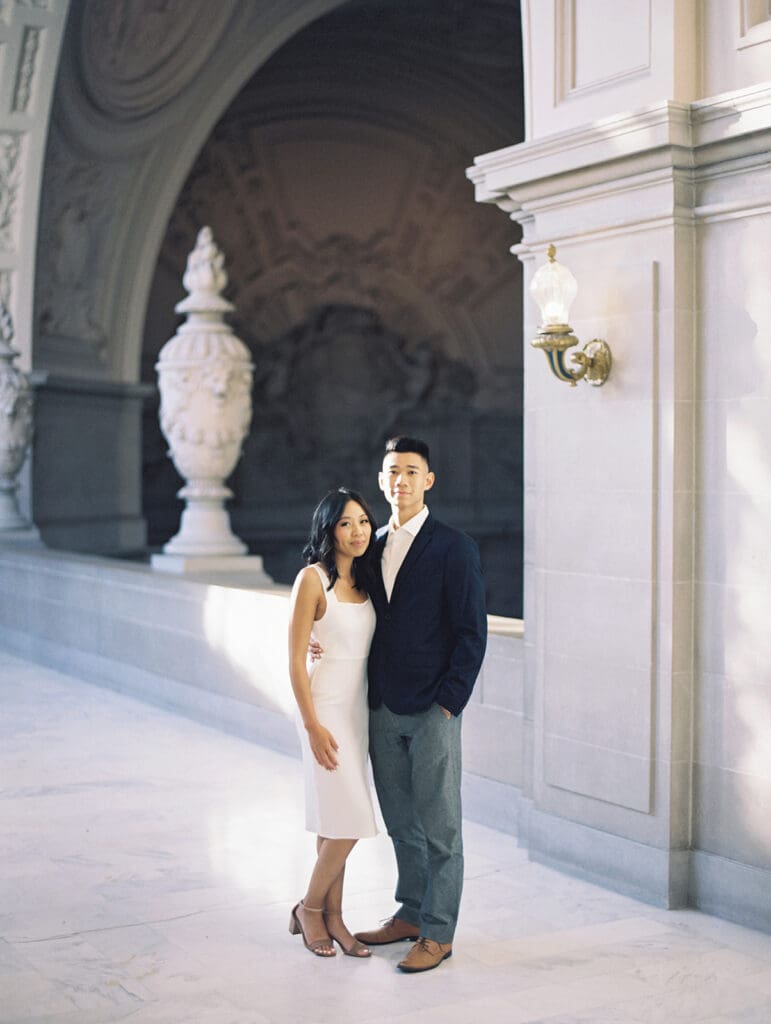 Couple posing for their San Francisco City Hall engagement photos