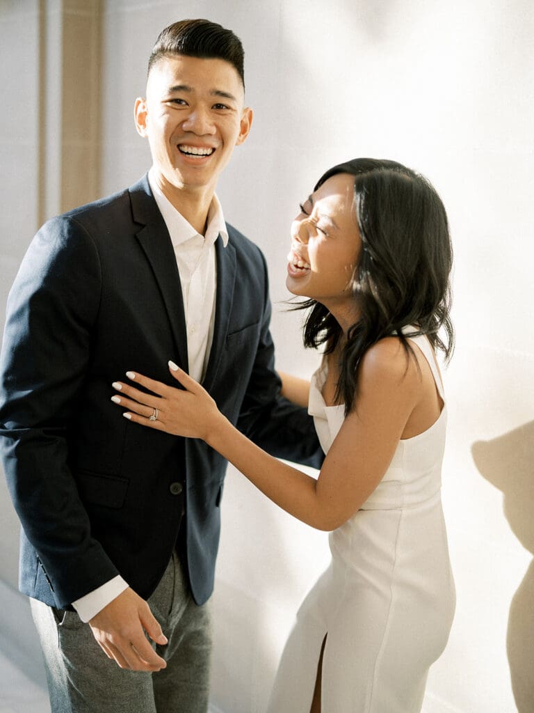 Couple laughing during their engagement shoot