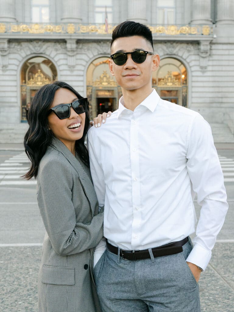 Couple posing for their city engagement photos in San Francisco