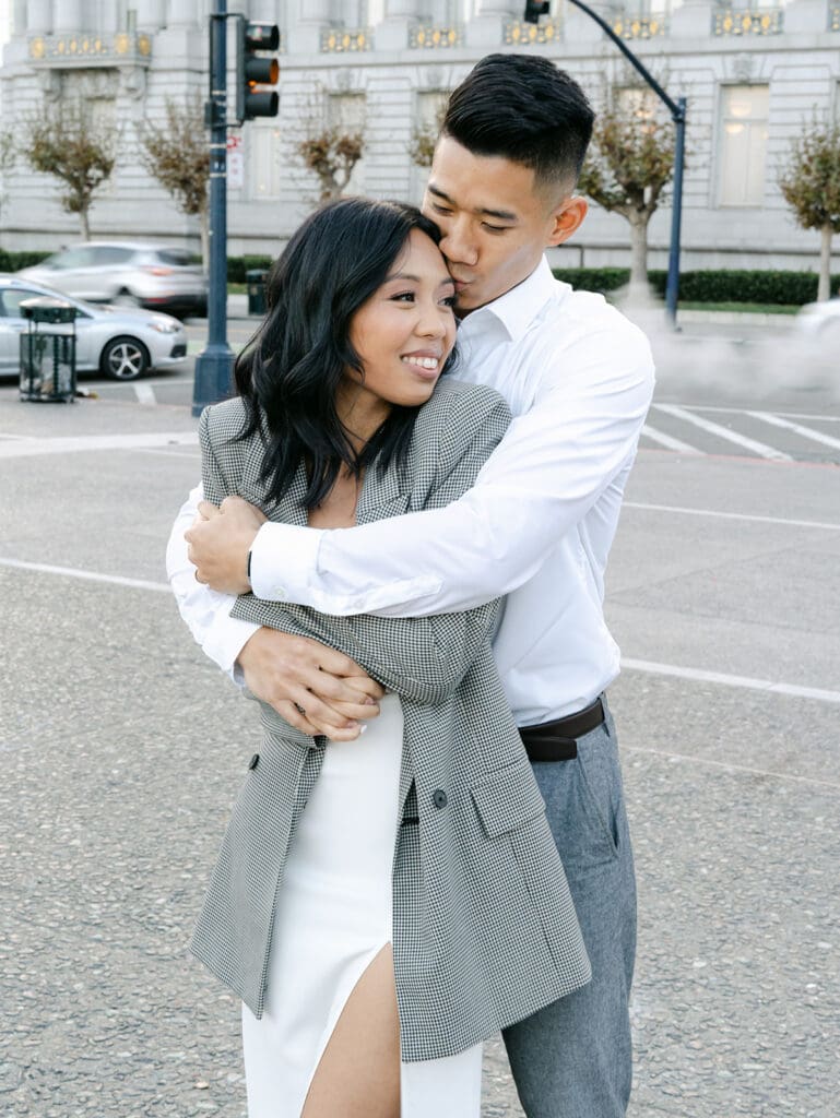 couple posing for their city engagement photos in San Francisco