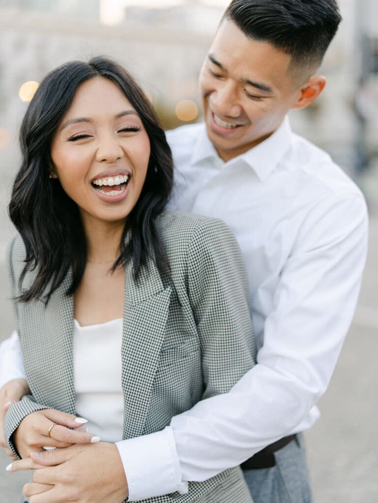 Couple laughing during their outdoor city engagement shoot