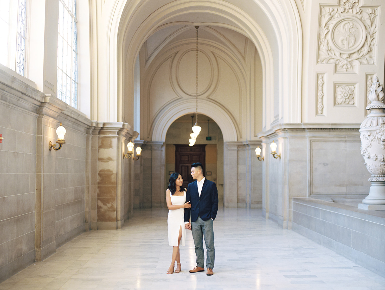 Couple posing for their San Francisco City Hall engagement photos